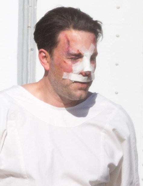 Exclusive... 51924748 Actor Ben Affleck is spotted on the set of his new movie 'Live By Night' looking beaten and bruised on December 8, 2015 in Los Angeles, California. Ben, who was also sporting a large tattoo on his back, was seen enjoying a cigarette outside of his trailer between takes. FameFlynet, Inc - Beverly Hills, CA, USA - +1 (818) 307-4813